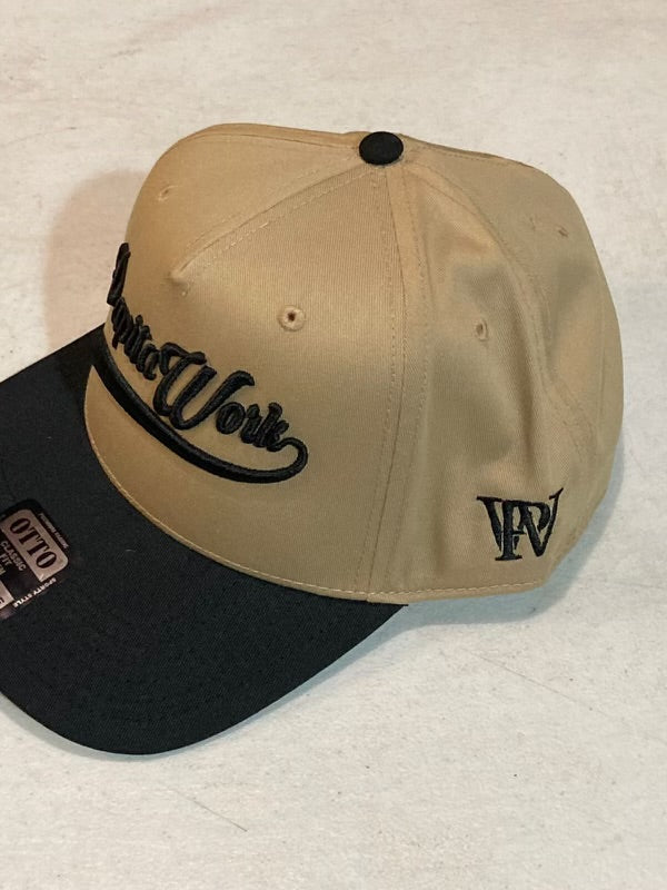 curved tan and green cap