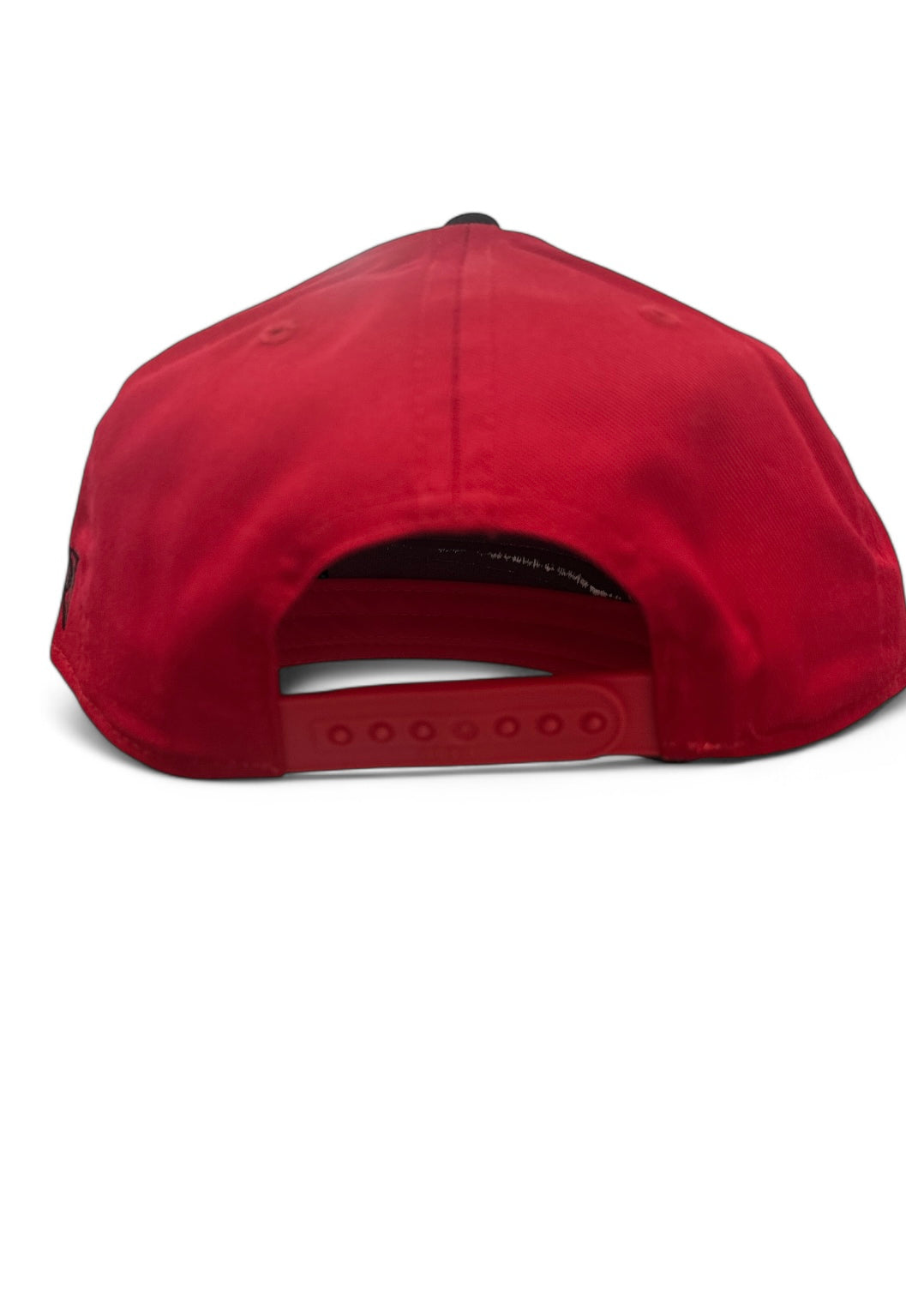 curved red and black visor cap