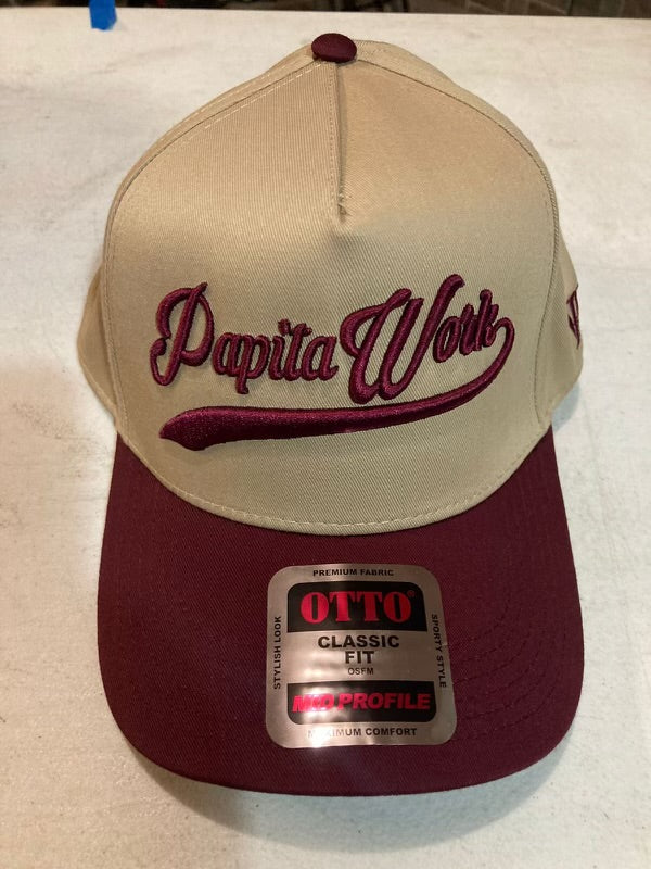 curved tan and maroon cap