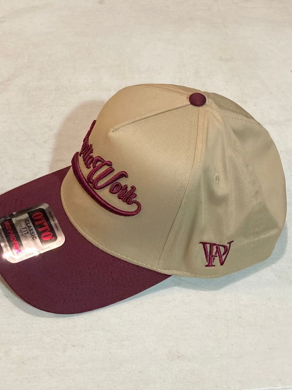 curved tan and maroon cap